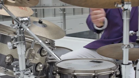 Man wearing suit playing the drumset, fast handsome beautiful drumming Stock Footage 118978741