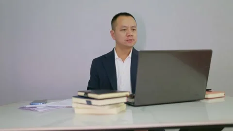 Man wearing a suit at work loses control of his emotions due to work stress Stock Footage 320093463