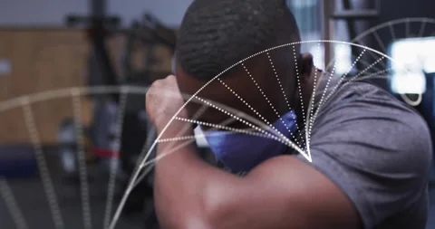 Man wearing training mask and leaning on bench in gym, showing performance data Stock Footage 327445125