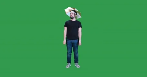 Man wearing umbrella hat gets swarmed by bees Stock-Footage 83630100