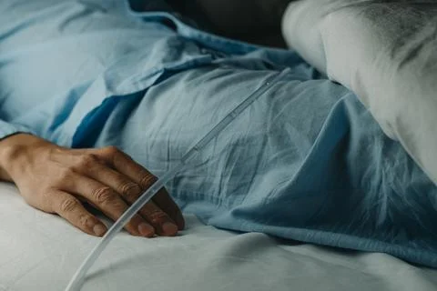 Man wearing a urinary catheterization in bed Stock Photos