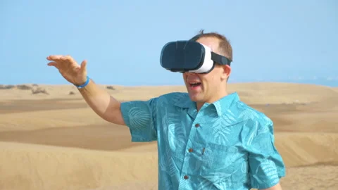 Man wearing virtual google on desert in 4K slow motion Stock Footage 88302529