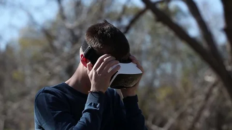 Man wearing virtual reality glasses outdoor Stock Footage 73579142