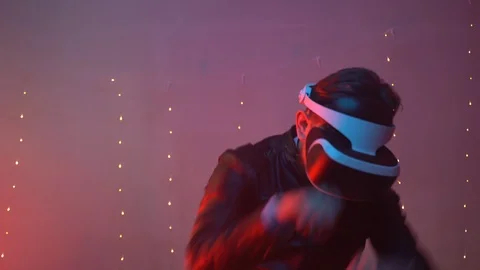 Man wearing virtual reality glasses and testing boxing game. Augmented reality Stock Footage 125532212