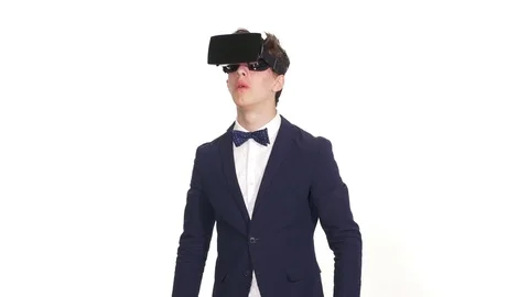 Man wearing virtual reality goggles gets surprised Video stock 71441007