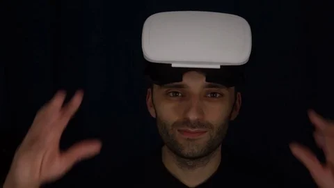 Man wearing virtual reality goggles. Studio shot.Virtual Reality Console Headset Stock Footage 73968333