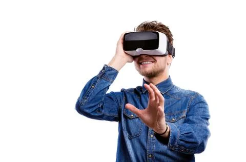 Man wearing virtual reality goggles. Studio shot, white backgrou Stock Photos