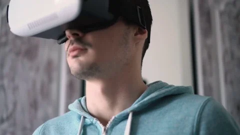 Man wearing virtual reality headset at living room. Stock Footage 74384503