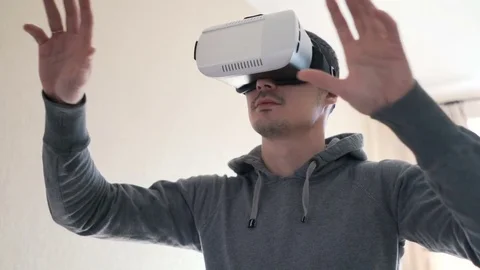 Man wearing virtual reality headset at living room. Video stock 74385186