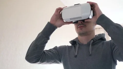 Man wearing virtual reality headset at living room. Stock Footage 74385441
