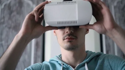 Man wearing virtual reality headset at living room. Stock Footage 74387949