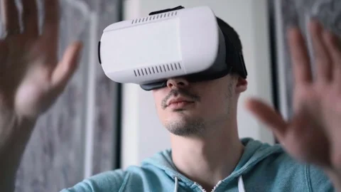 Man wearing virtual reality headset at living room. Stock Footage 74435712