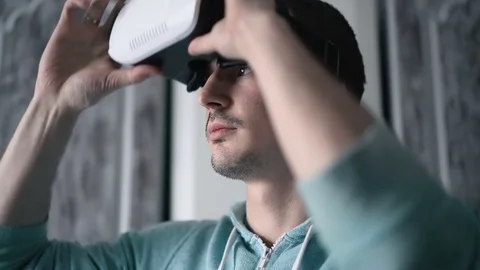 Man wearing virtual reality headset at living room. Stock Footage 74435778