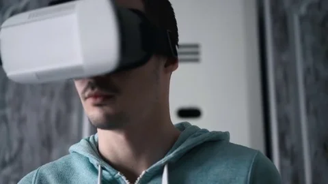 Man wearing virtual reality headset at living room. Stock Footage 74639934