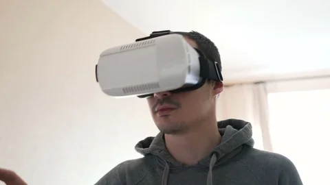 Man wearing virtual reality headset at living room. Stock Footage 74640161