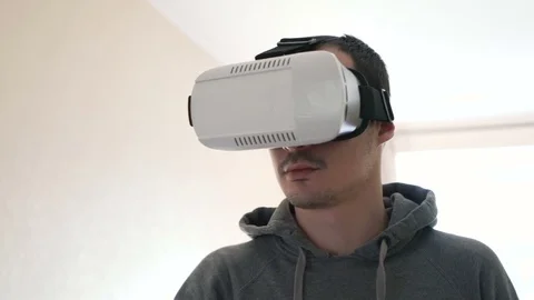 Man wearing virtual reality headset at living room. Stock Footage 74640224