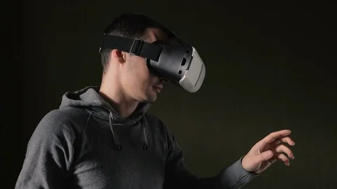 Man wearing virtual reality headset at living room. Video stock 74640632