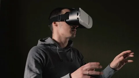 Man wearing virtual reality headset at living room. Stock Footage 74640645