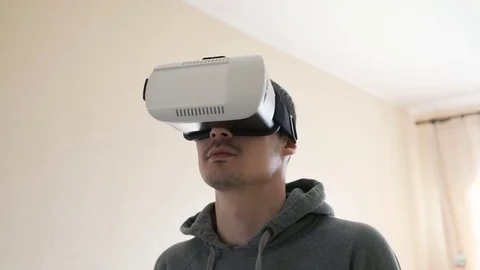 Man wearing virtual reality headset at living room. Stock Footage 74678553