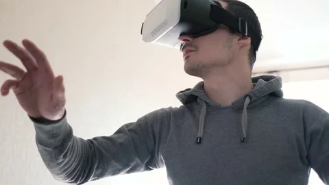 Man wearing virtual reality headset at living room. Stock Footage 74678706