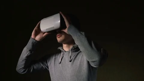 Man wearing virtual reality headset at living room. Stock Footage 74692249