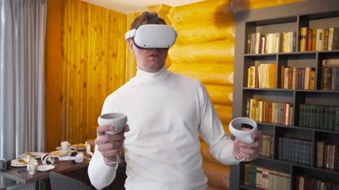Man wearing virtual reality headset draws abstract lines and figures with Stock Footage 167255958