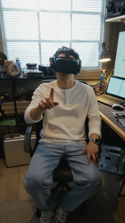 Man Wearing Virtual Reality Headset Interacting with Interface Stock Footage 338421955