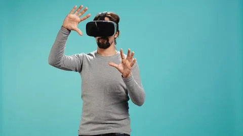 Man wearing virtual reality headset, interacting with interface, Stock Photos