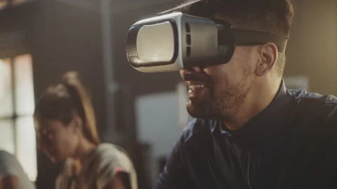 Man wearing VR glasses doing cycling 스톡 동영상 236190021