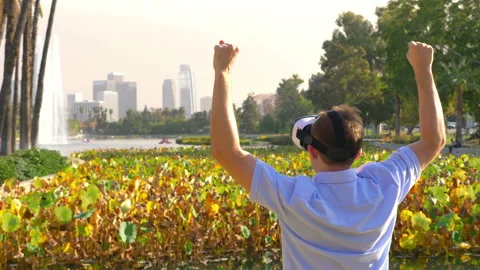 Man wearing VR glasses in Echo park Los angeles in 4k slow motion 60fps Stock-Footage 105320095