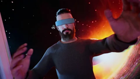 Man Wearing VR Glasses Jumping into Virtual Reality Through Portal Door into Spa Stock Footage 239462477