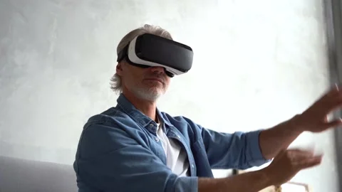 Man wearing VR headset. Handsome man resting use VR glasses. New technologies Stock Footage 141186514