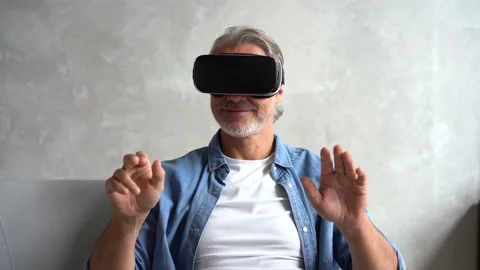 Man wearing VR headset. Handsome man resting use VR glasses. New technologies Stock Footage 141186521