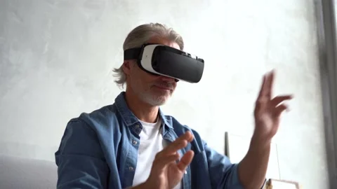 Man wearing VR headset. Handsome man resting use VR glasses. New technologies Stock Footage 141186602