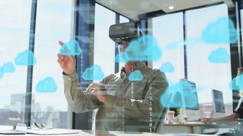Man wearing VR headset in office activating cloud HUD, pointing and dragging Stock Footage 333445151