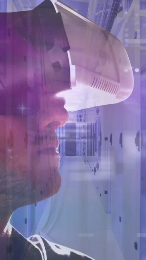 Man wearing VR headset over network of computer servers and data processing in Stock Footage 343498996