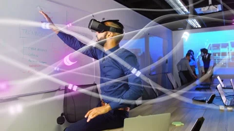 Man wearing VR headset raising hands in meeting, touching glowing data nodes Stock Footage 333975674