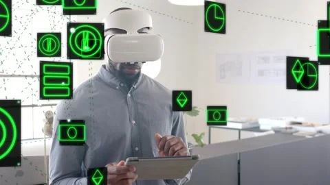 Man wearing VR headset tapping tablet and navigating green holo UI in tech Stock Footage 333670701