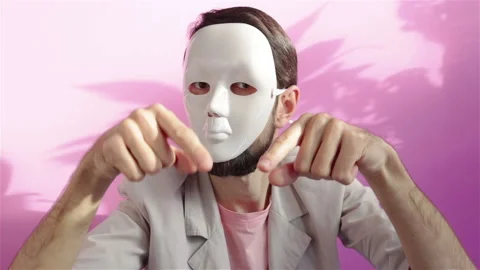 Man wearing white mask gesturing with hands portrait Stock Footage 121668891