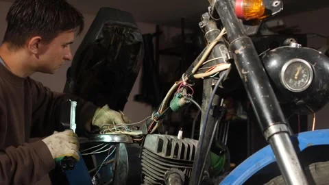 Man wearing work gloves inspecting and fixing complex electrical wires and 库存影片 340430366