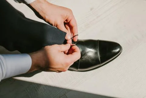 Man wears black boots Stock Photos