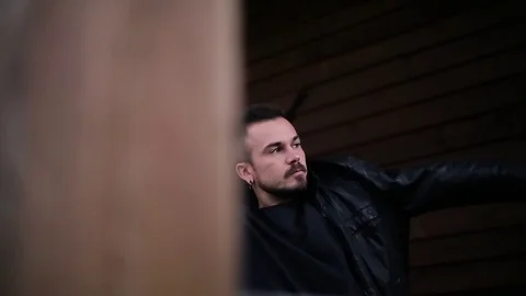 Man wears a black jacket on the stree Stock Footage 70176006