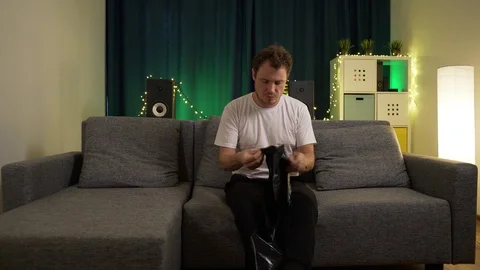 The man wears on his head a garbage bag and go Stock Footage 129420113