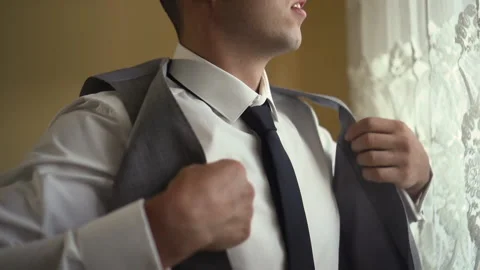 A man wears a jacket and tie 스톡 동영상 167453087