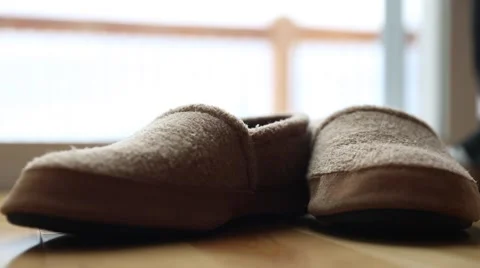 Man wears a pair of slippers Stock Footage 45988664