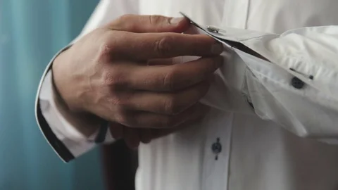 Man wears shiny cufflinks Stock Footage 70897976