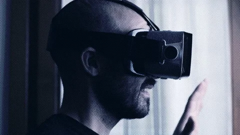 Man wears virtual reality goggles. Augmented reality concept with transition Stock Footage 165169809