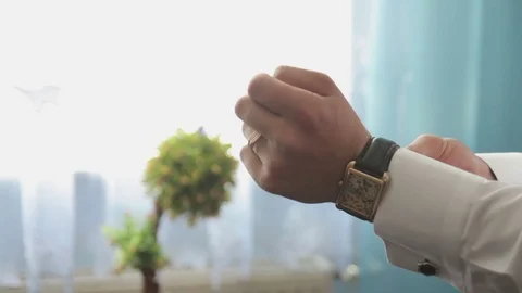The man wears a watch Stock Footage 70901374