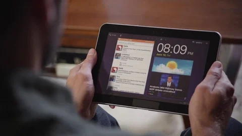 Man web surfing on digital tablet at home 스톡 동영상 83185048