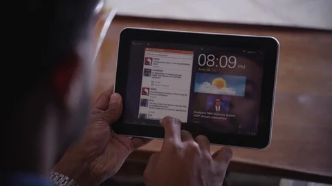 Man web surfing on digital tablet at home Stock Footage 83185171